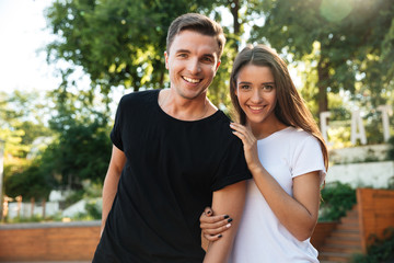 Portrait of a happy young couple in love hugging