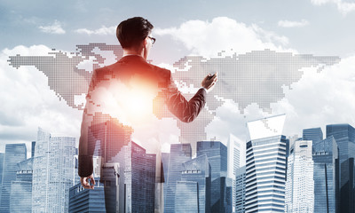 Concept of business success and control with confident boss against cityscape background