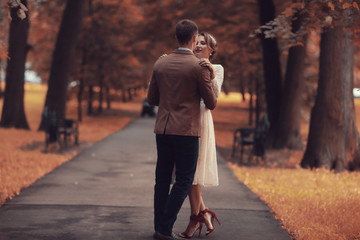 Wedding dance in the park of young bride and groom