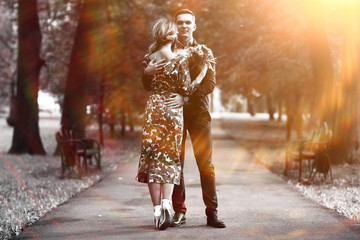 Fototapeta premium Wedding dance in the park of young bride and groom
