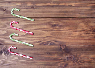 Wooden brown background. Christmas candy can