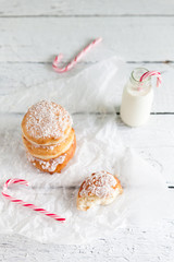 Deep-fried doughnuts filled with coconut custard cream