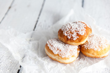 Deep-fried doughnuts filled with coconut custard cream