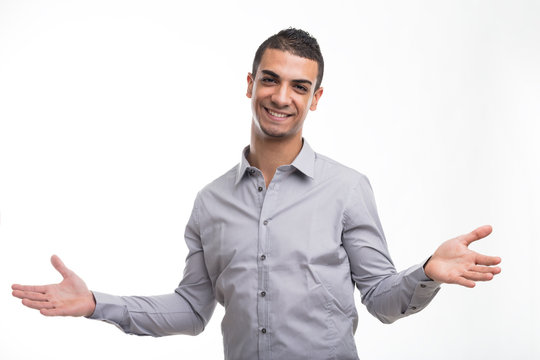 Young cheerful man with open arms gesture