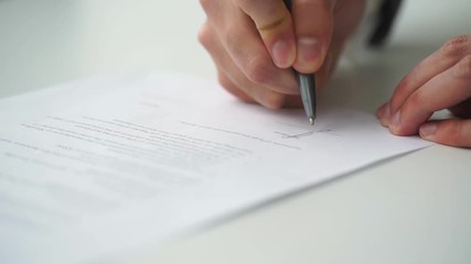 Businessman is signing a contract, business contract details - Powered by Adobe