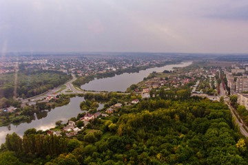Arial view of a beautiful landscape of a park, a city and a lake.