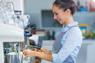 Female barista making coffee
