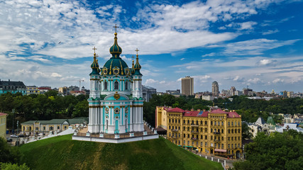 Aerial top view of Saint Andrew's church and Andreevska street from above, cityscape of Podol...