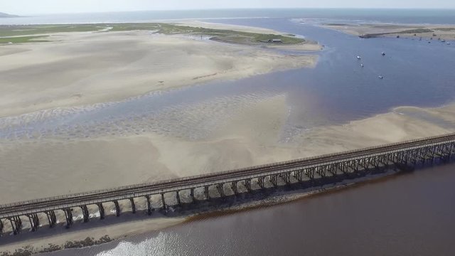 Aerial Shot Looks Out to Sea Over the Barmouth Viaduct