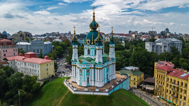 Aerial top view of Saint Andrew's church and Andreevska street from above, cityscape of Podol district, city of Kiev (Kyiv), Ukraine

