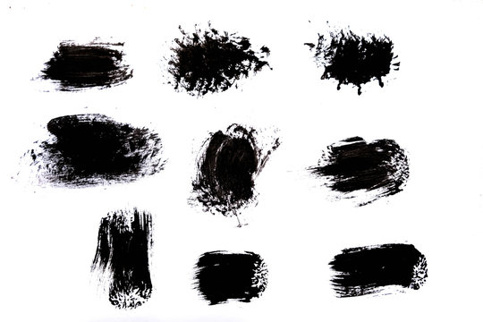 Strokes of black paint isolated on white background.