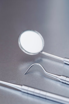 Close Up Of Dental Instruments On Metal Surface