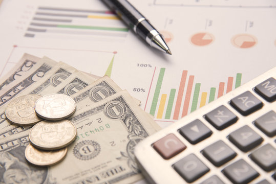pen, calculator, money, graph stock concept for business finance.