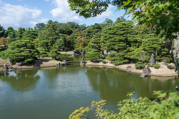Fototapeta na wymiar Beautifully manicured grounds of Imperial Palace, Oikeniwa Garden, Kyoto, Japan
