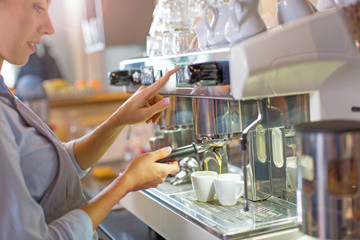Female barista making coffee
