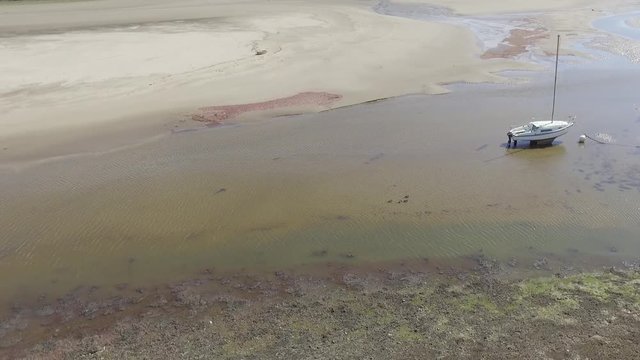 Moderate Speed Aerial Shot Flying Into Fairbourne Estuary