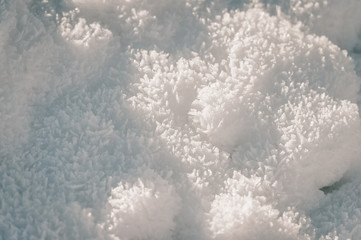 Background of fresh snow texture on a sunny day