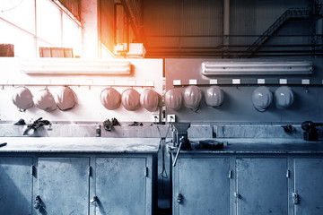 dirty construction safety helmet hanging on the wall.safety conceptual