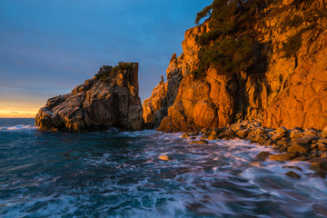 First sunbeams of the day in Cala s'Aguia on the Costa Brava area