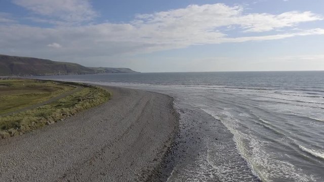 A Slow Aerial Shot Flying Over the Stony Beach