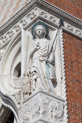 Fototapeta na wymiar Doge's Palace on Piazza San Marco, relief on facade , Venice, Italy.