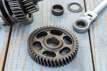 Gear wheels on a old wooden table