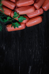 sausages - meat semi-finished product on a black background
