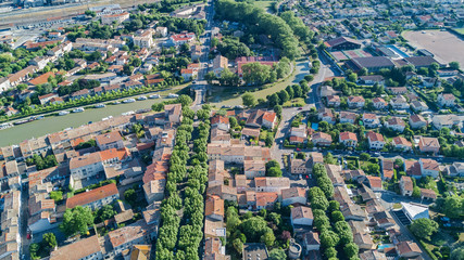 Aerial top view of residential area houses roofs and streets from above, old medieval town background
