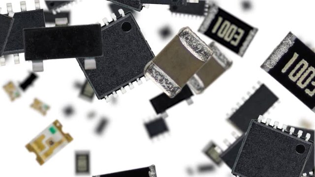 Electronic components falling down on white background (45 degrees, seamless loopable) in 4K footage