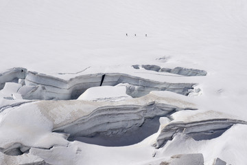 Glacier crevasses and seracs in a snow field in the Mont Blanc area.