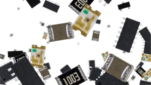 Electronic components falling down on white background (vertical, not loopable) in 4K footage
