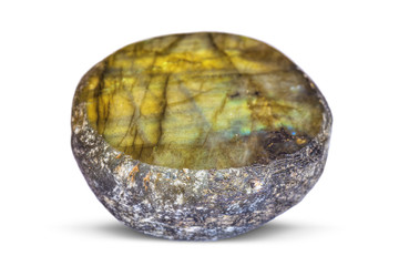 The semi-precious stone Labradorite on one side is polished, on a white background.