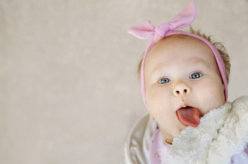 little girl shows her tongue