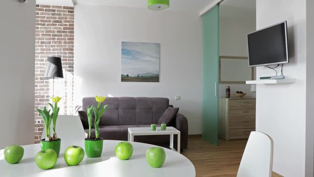 4K. Interior of a new modern apartment in scandinavian style. Motion panoramic view. NOTE: PHOTO ON THE WALL WAS MADE AND PRINTED BY ME!!!