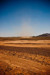 Fototapeta na wymiar Small tornado arising in the arid desert of Morocco