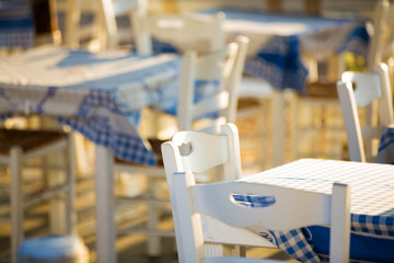 Outdoor cafes in coastline resort Kamari in Santorini Greece