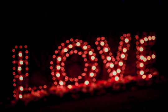 Disfocus of the Love word  light bulbs. Background.