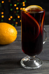 mulled wine on background with blurry lights