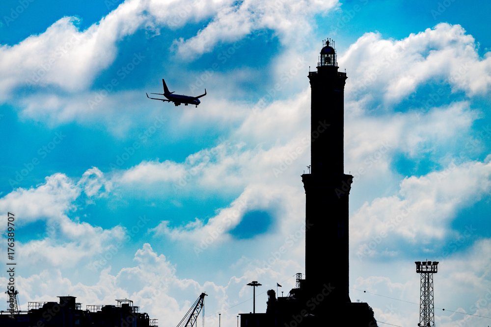 Wall mural airplane near lightouse lanterna genoa town italy symbol