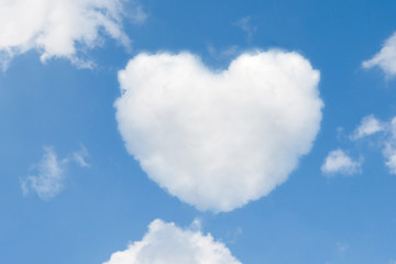 Naklejka na ściany i meble blue sky with hearts shape clouds. Valentine's holiday background. Vector