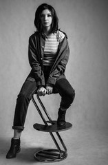 Young woman sitting on the high chair