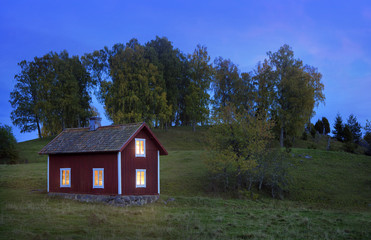 Old wooden house in Sweden at dusk