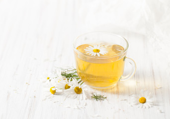 A decoction of dry chamomile flowers in a Cup