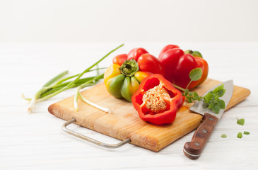Sweet colorful raw sliced peppers on the kitchen Board