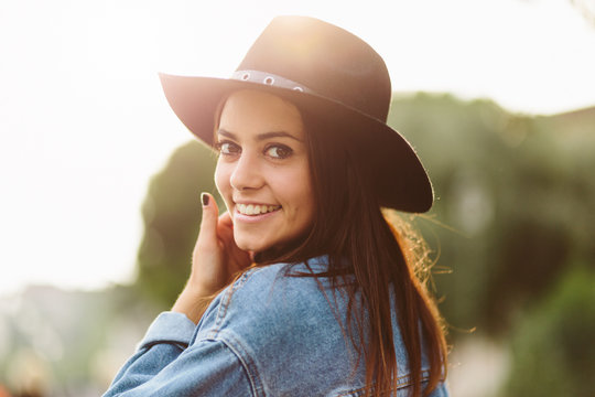 Beutiful brunette in the city in autumn