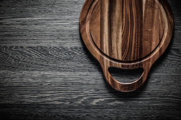 Chopping board on wood background