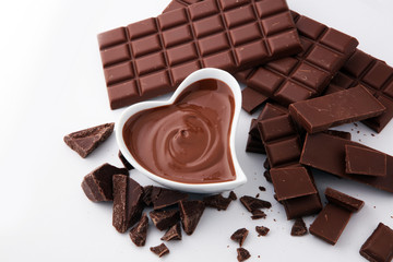 Melting chocolate or melted chocolate and chocolate swirl. stack and powder.