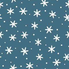 Winter seamless pattern. White snowflakes on blue background.