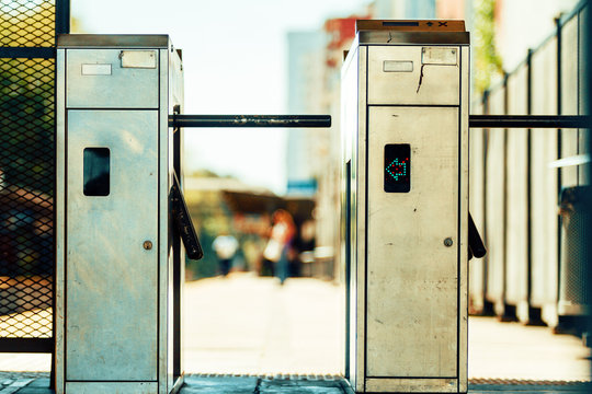 Turnstiles at a train station seen from the front
