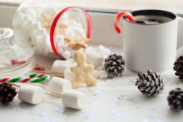 Beautiful Christmas background cookies, new year sweets and cup of coffee on white background